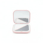  Portable LED Makeup Mirror with magnification, compact and travel-friendly design in pink.