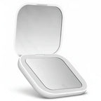 Portable LED Makeup Mirror with magnification, compact and travel-friendly design in pink.